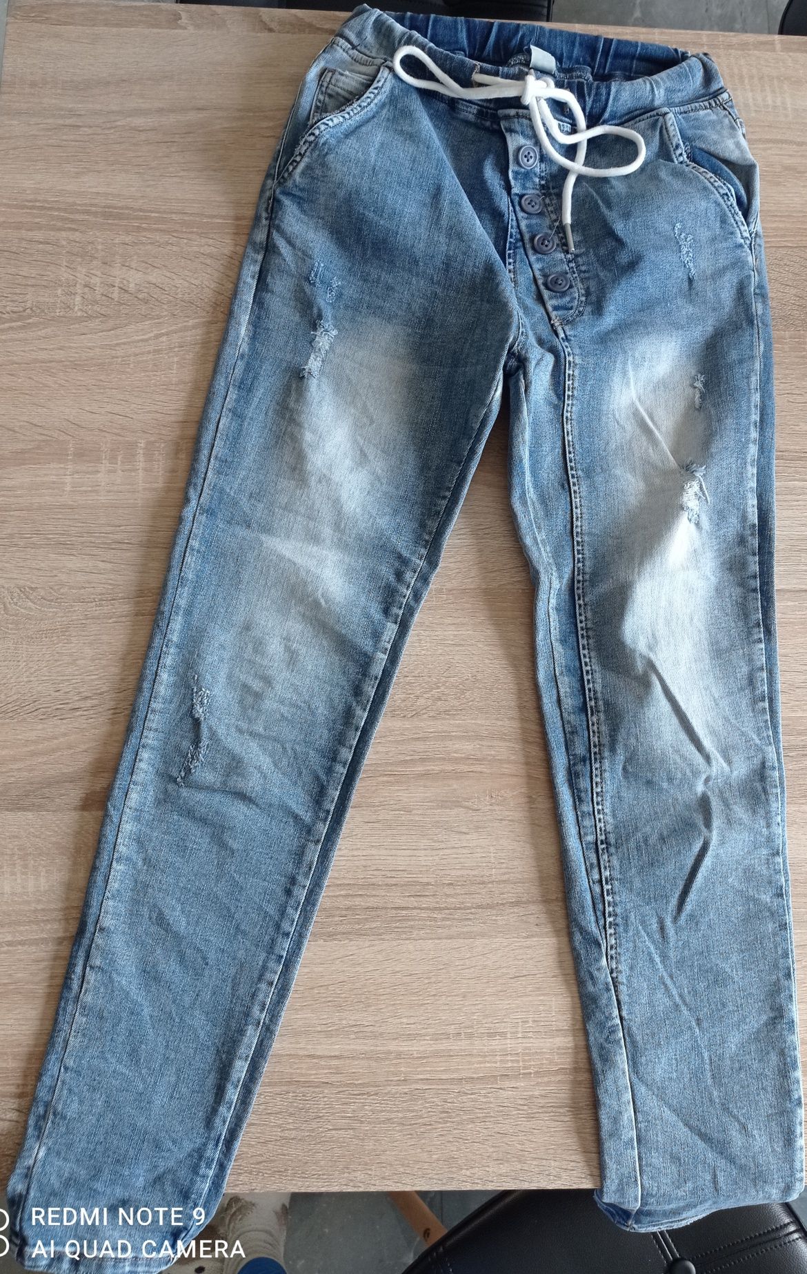 Spodnie jeans 34