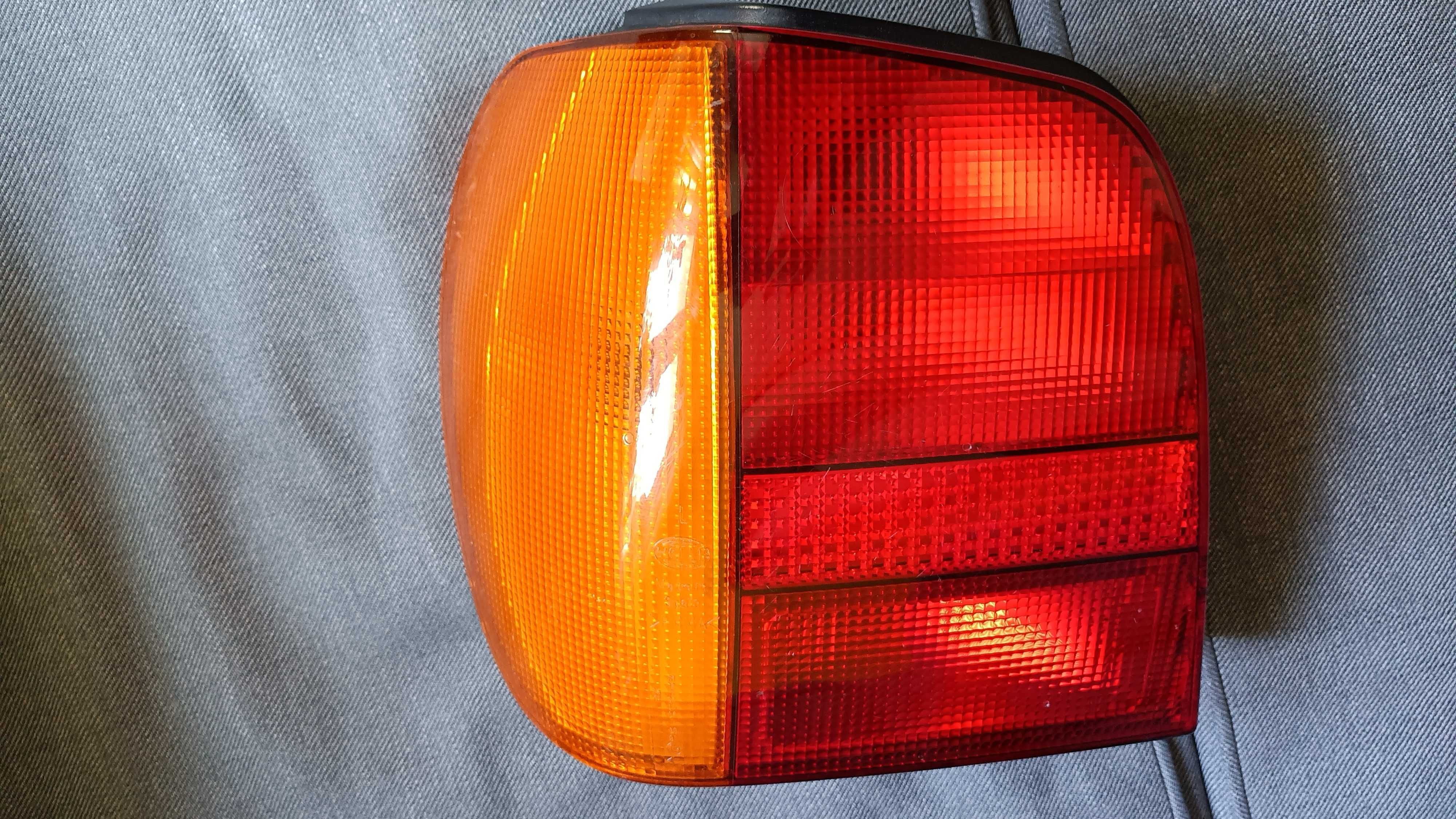 Lampa lewa tylna tył VW Polo 94-99 Hella