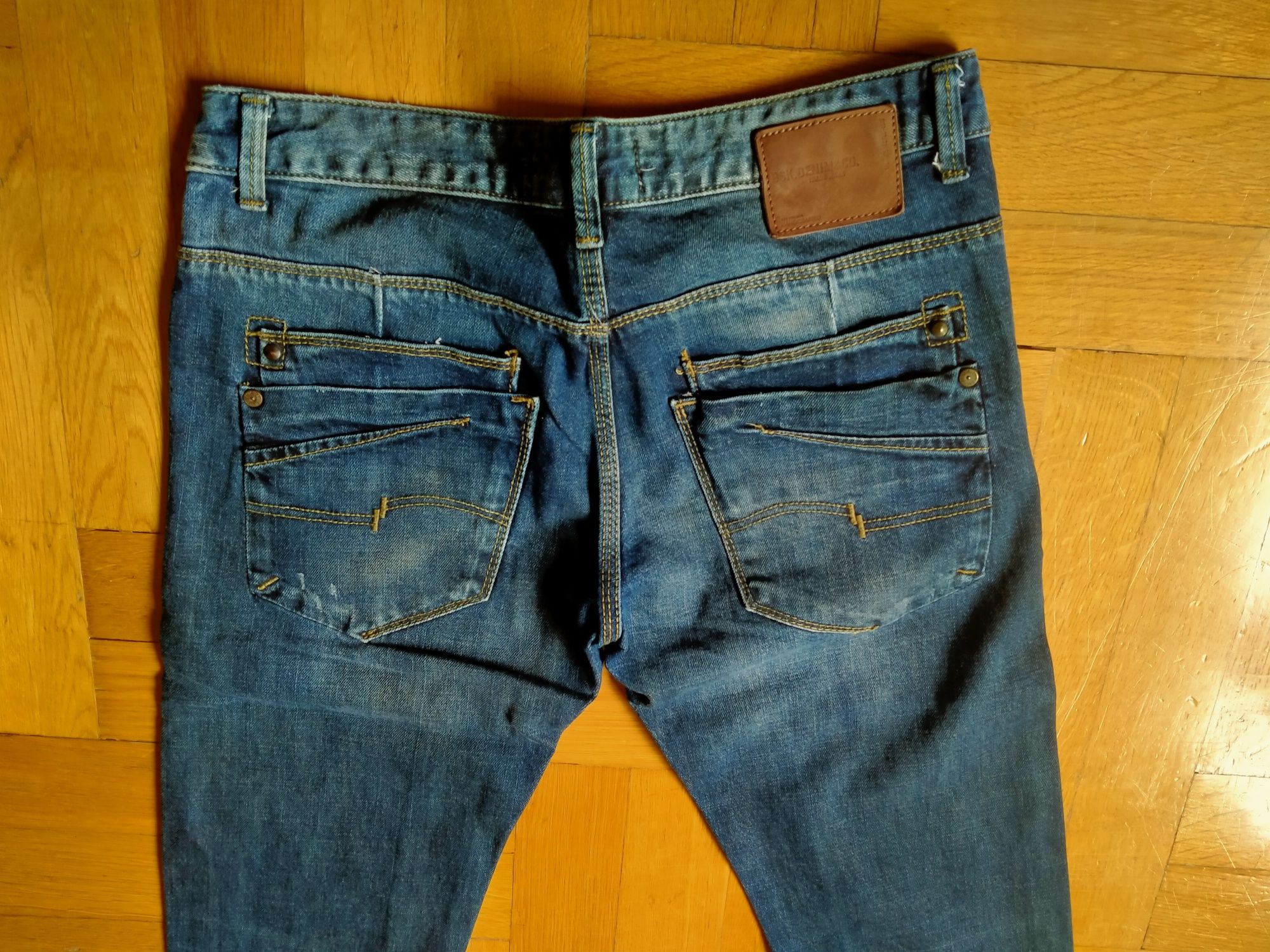 Spodnie męskie jeans przecierane z dziurami EU 38/pas 86cm Bershka