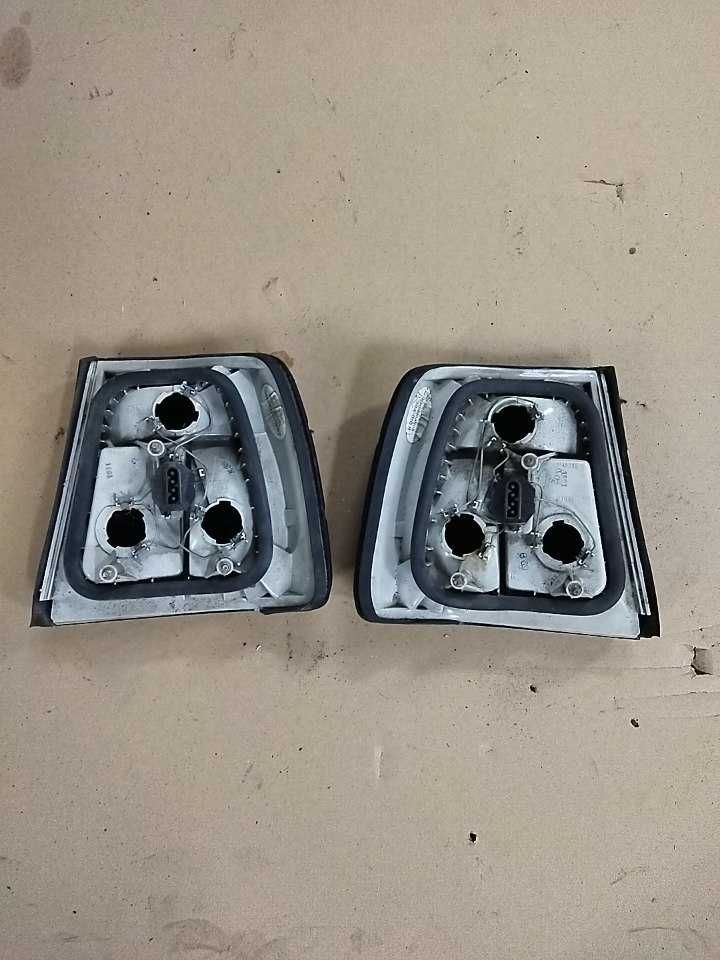 Stare zabytkowe lampy BMW E34 Black czarne ciemne Hella