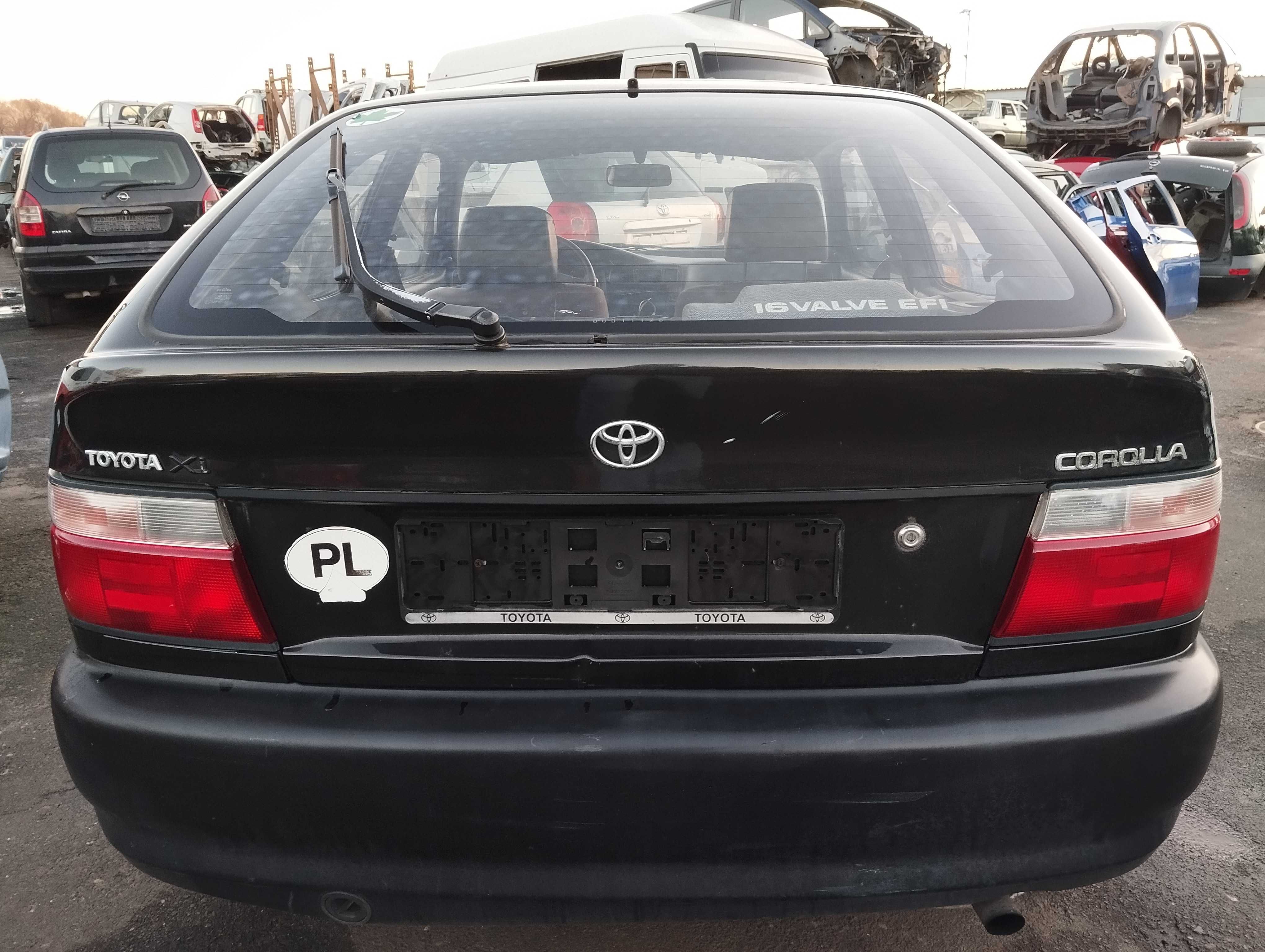 Toyota Corolla AE100 1.4i 3D 1996r.Zderzak tylny.