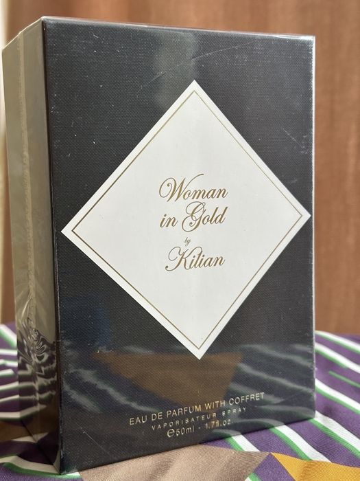 Kilian woman in gold