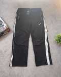 Czarne spodnie dresowe Nike rozpinane