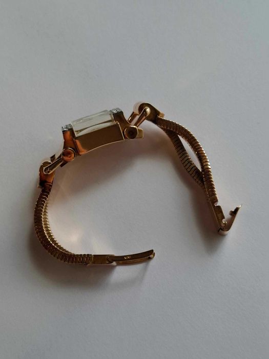 Relógio de corda todo em ouro e diamantes