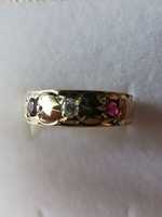 Złoty pierścionek ala obrączka wysadzana brylantem i rubinami