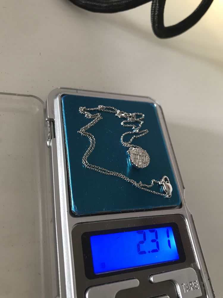 Łańcuszek białe złoto z diamentami próba : 585 waga : 2,31 gram .