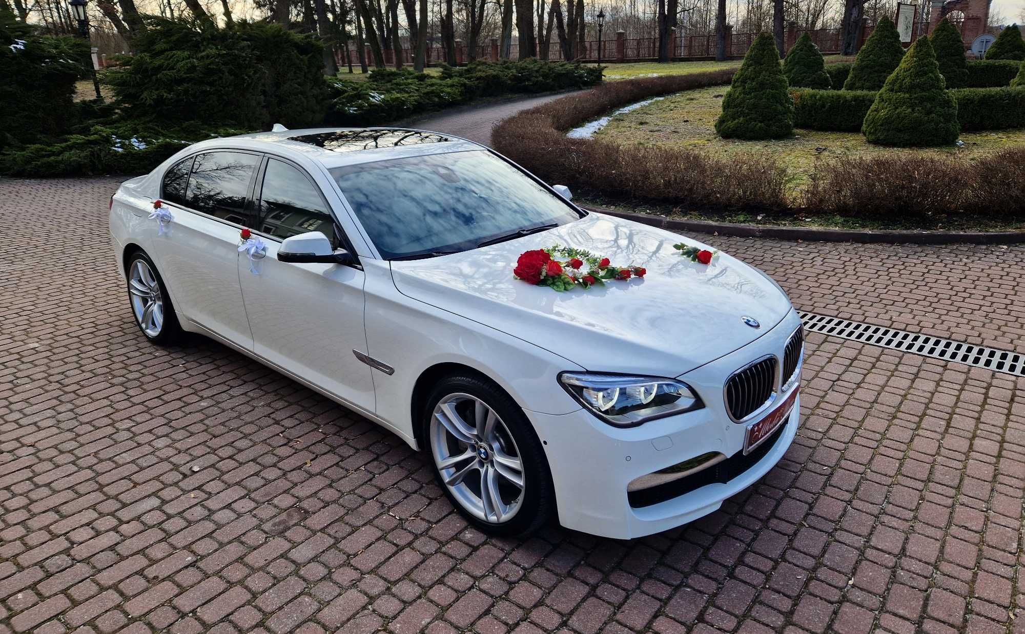 Białe auto do ślubu BMW Serii 7 F01 / F02 Wynajem Ślub białe BMW F02