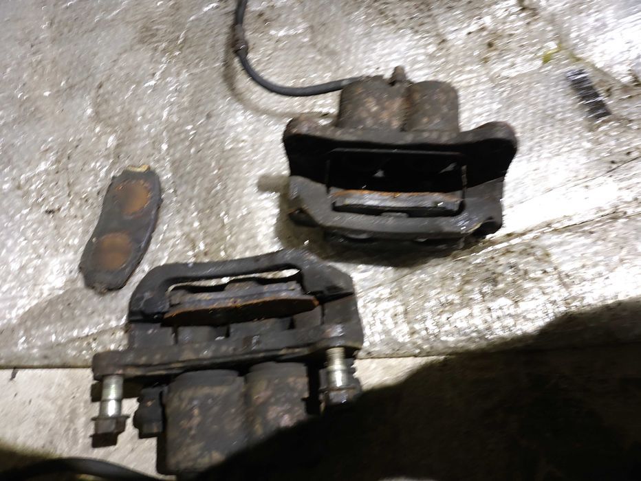 Zacisk hamulcowy przód  lewy Mazda CX7 CX-7 2.3T OEM