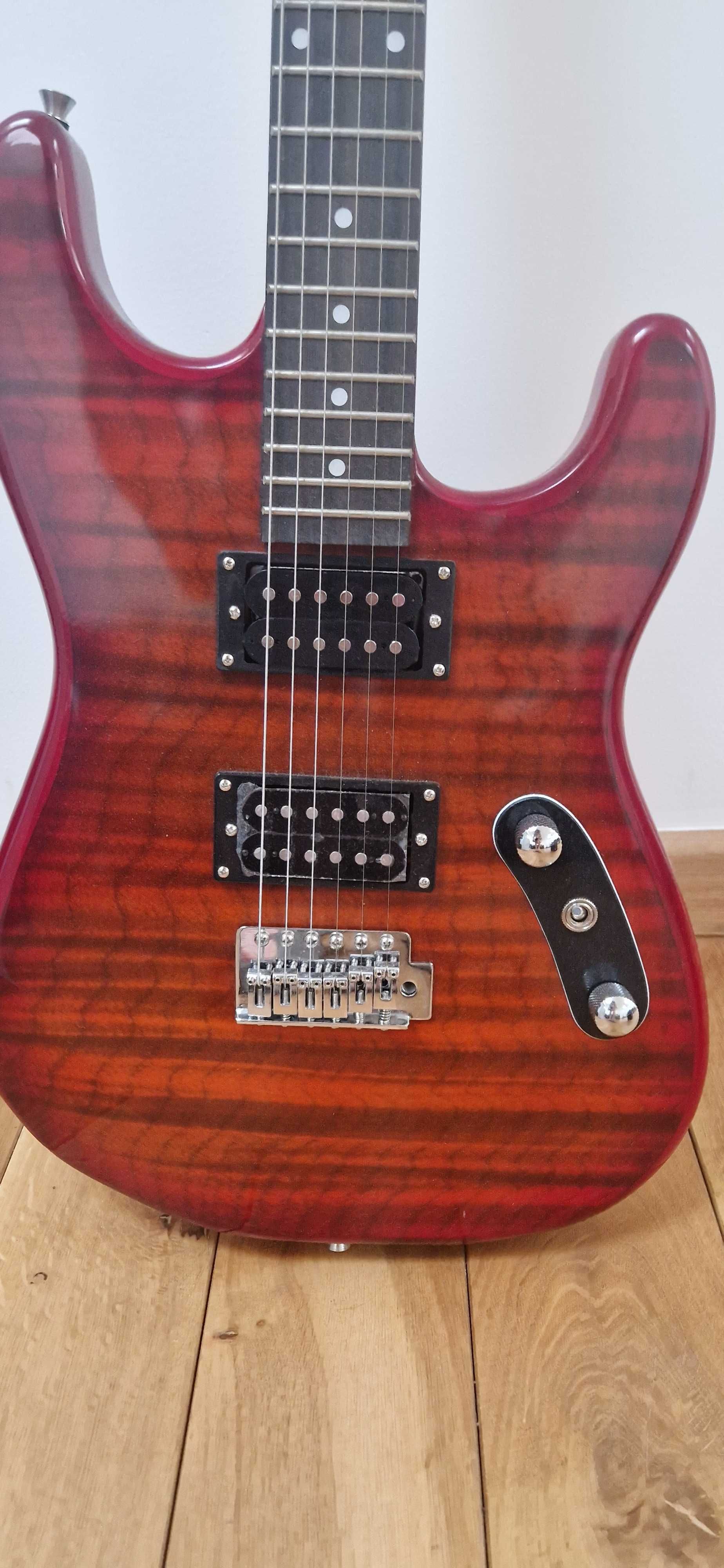 Gitara elektryczna, i wzmacniacz typu combo.