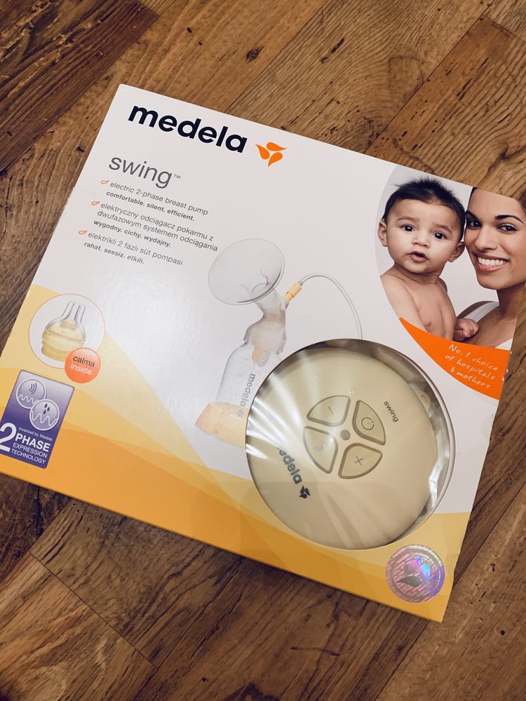 Молокоотсос medela swing + подарок