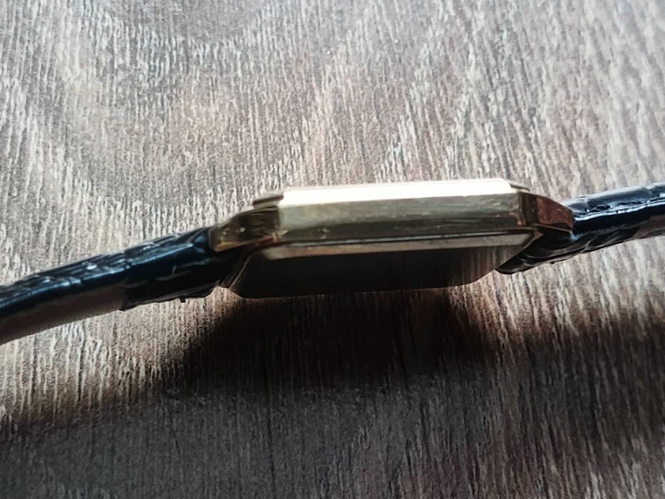 Sprzedam złocony męski zegarek garniturowy Deloitte & Touche