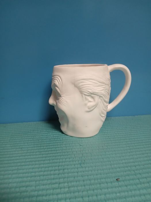 Kubek z motywem twarzy jokera