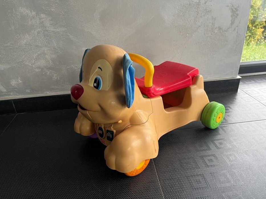 piesek fisher price jeździk