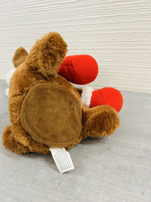 Інтерактивна різдвяна собачка. Співає пісні та шевелить вухами.