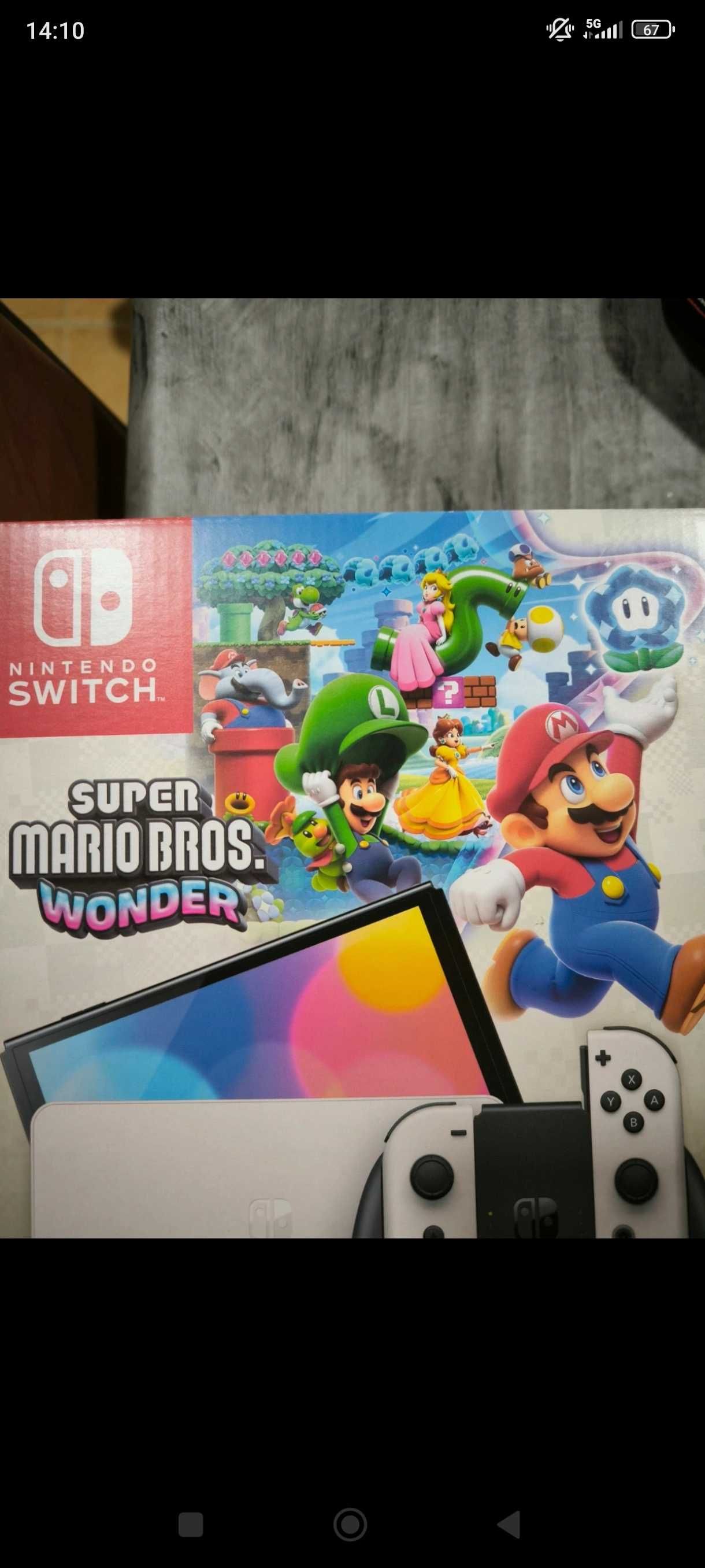 Nintendo Switch OLED Version (Super Mario Wonder + FC25)