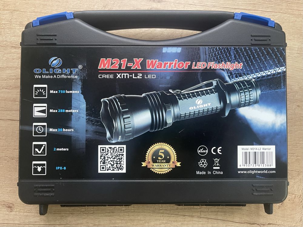 Latarka Olight M21-X Warrior + 2x akumulator 18650 oraz ładowarka
