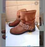 Botas em pele castanha