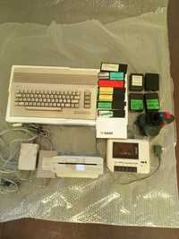 Commodore64,stacja dyskietek, magnetofon,zasilacze, joystick, cartridg