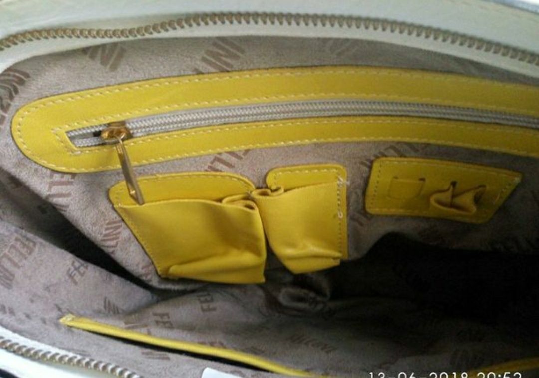 Эффектная женская кожаная сумка от итальянского люкс бренда FELLINI