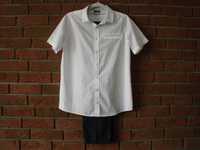 Biała koszula i granatowe spodnie dla chłopca Coccodrillo rozm. 164