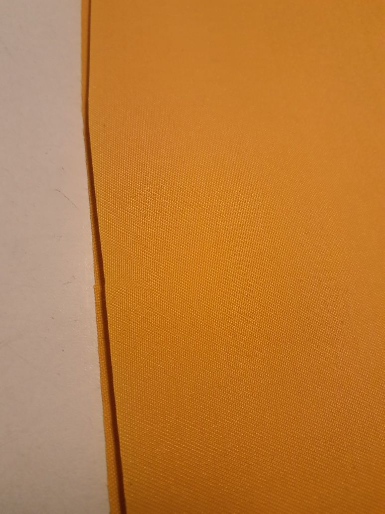 Tkanina nieprzemakalna żółta szer.150 cm.