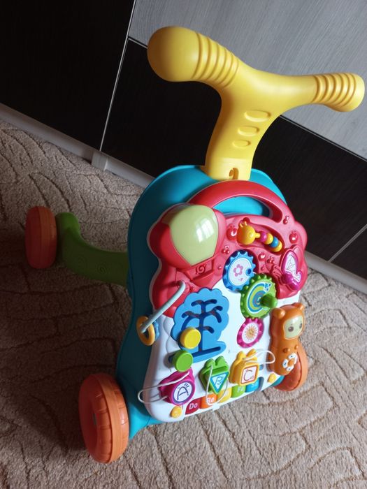 Дитячі ходунки-каталка, ігровий центр-столик Перші кроки 2в1