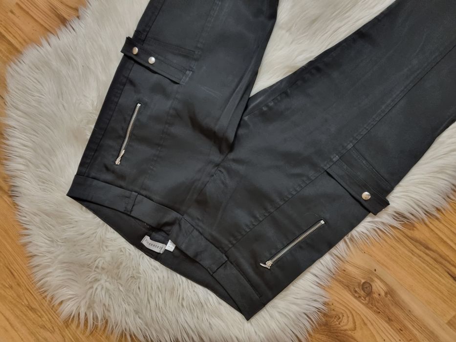 Spodnie damskie czarne z klamrami XL