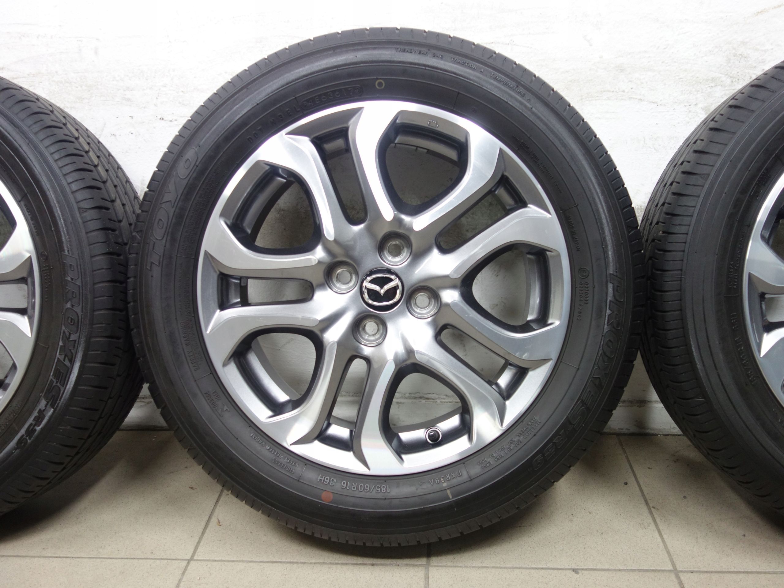 185/60R16 4x100 Koła letnie Mazda 2 OE opony Toyo Proxes R39 Jak nowe