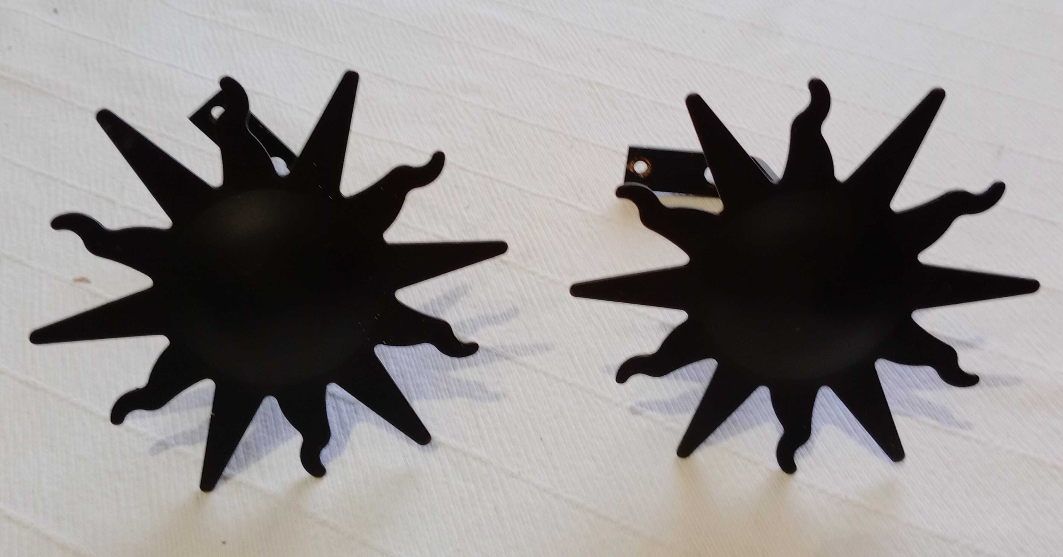 Suportes para varão, pretos forma de Sol, com terminais inclusos - Par