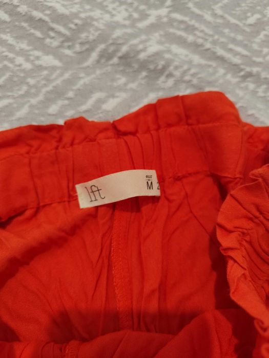 Calções de tecido laranja-tijolo