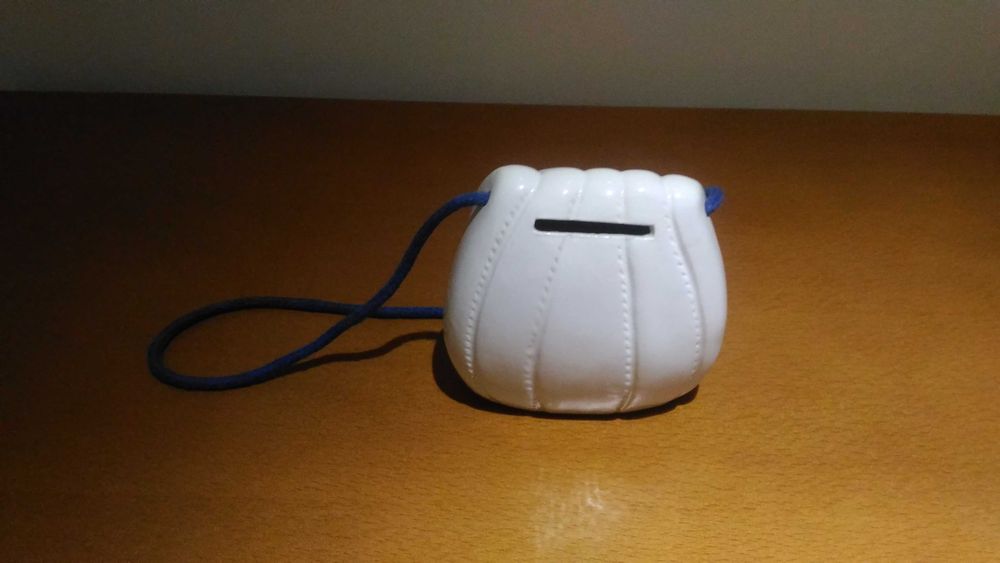 Conjunto de mealheiro e porta retratos em louça. Novo