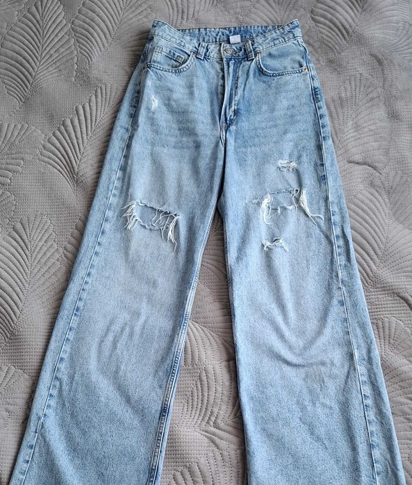 Spodnie jeansowe dzwony z dziurami, wąska talia, H&M rozm. 34