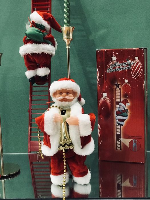 Іграшка дереться по ланцюжку дід Моороз