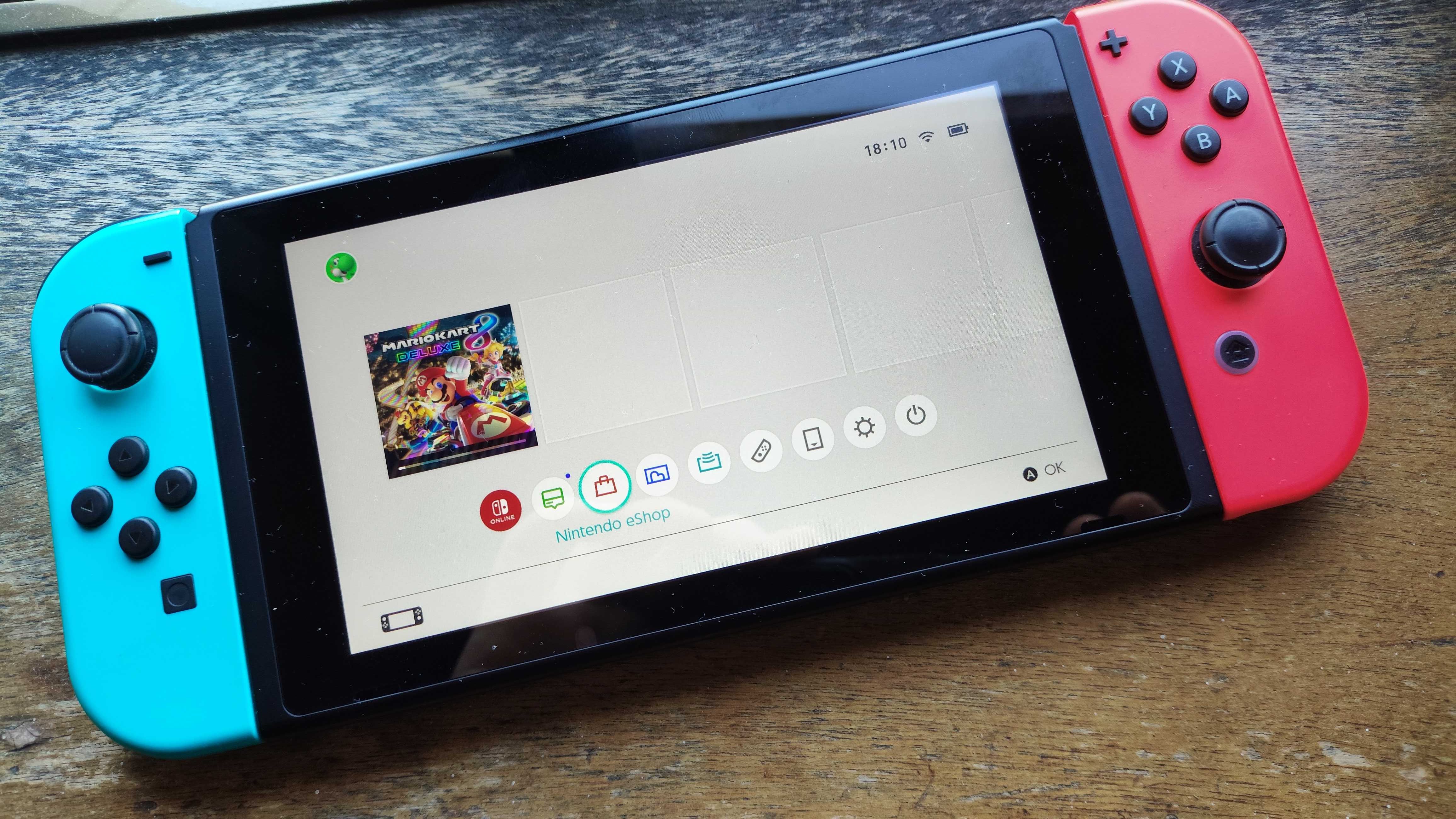 Nintendo Switch (Versão v2) + Cartão MicroSD 128GB + Bolsa