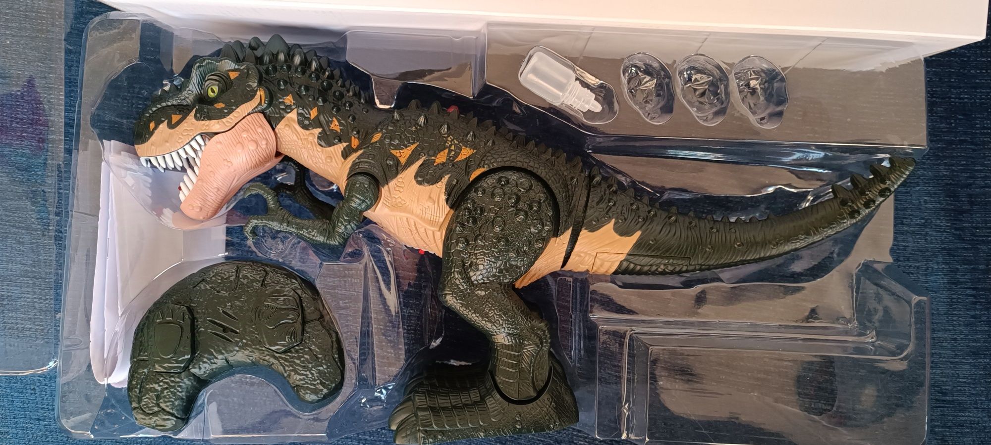 Brinquedo Dino T-Rex telecomandado com sons, vapor da boca  larga ovos