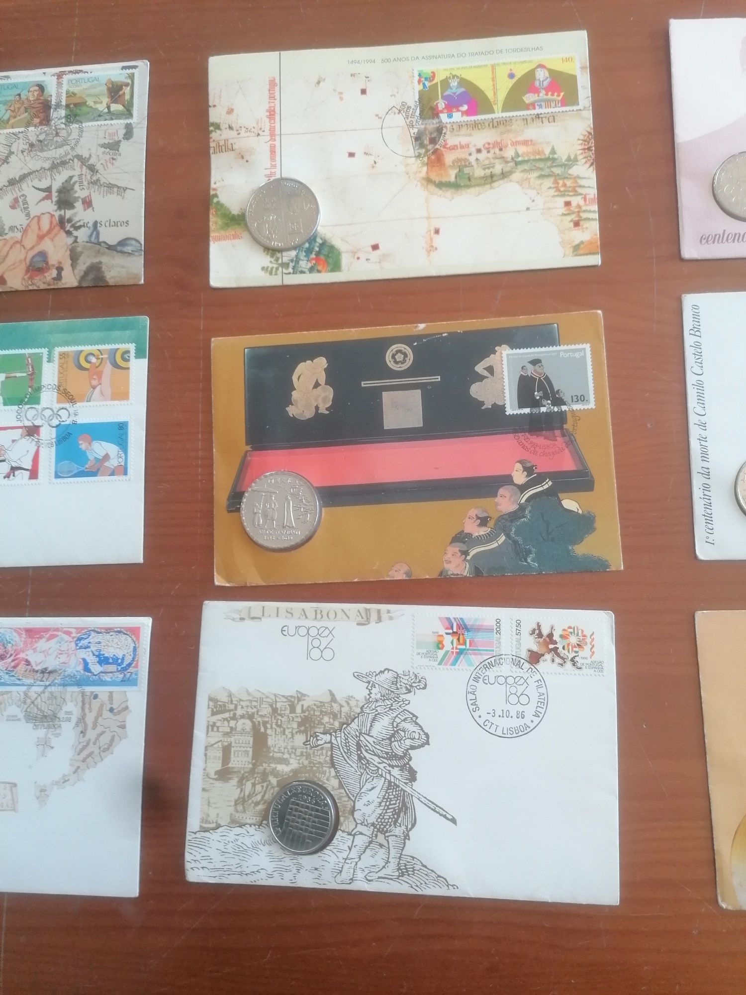 9 envelopes selados e com moedas novos e antigos