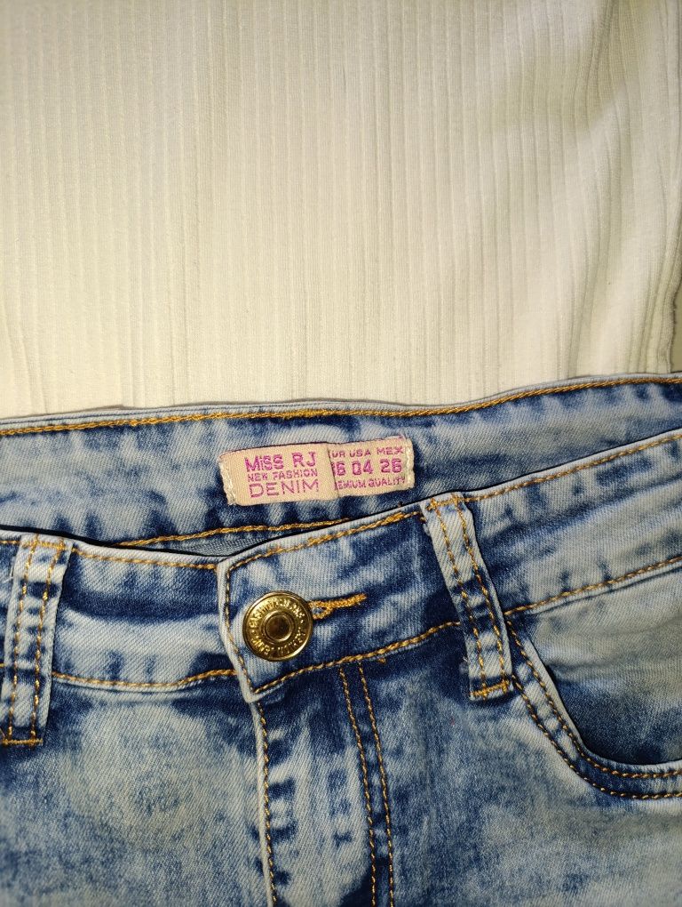 Spodnie jeansy damskie dziury jeans niebieskie błękitne dziury S 36
