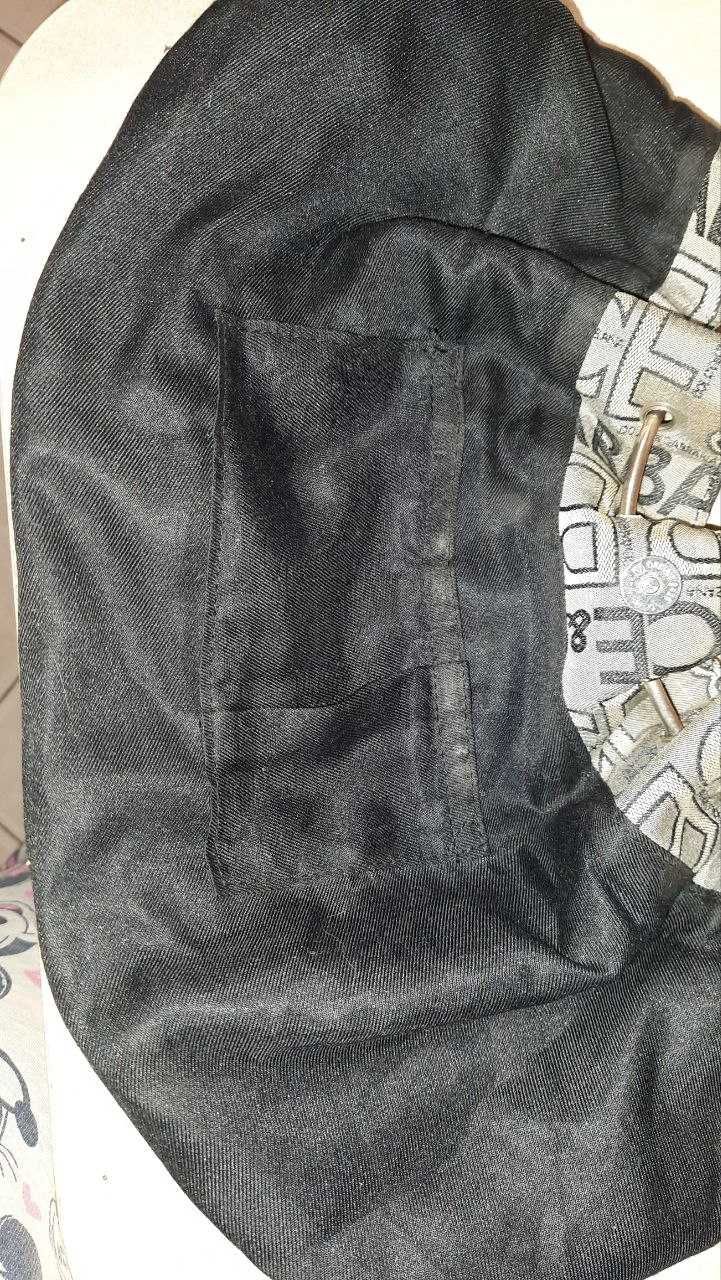 Необычная текстильная сумочка с ручками-кольцами и надписями Dolce&Gab