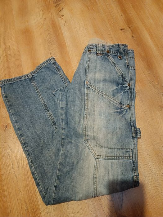 Szerokie jeansy z przetarciami New look