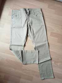 Męskie beżowe jeansy 32