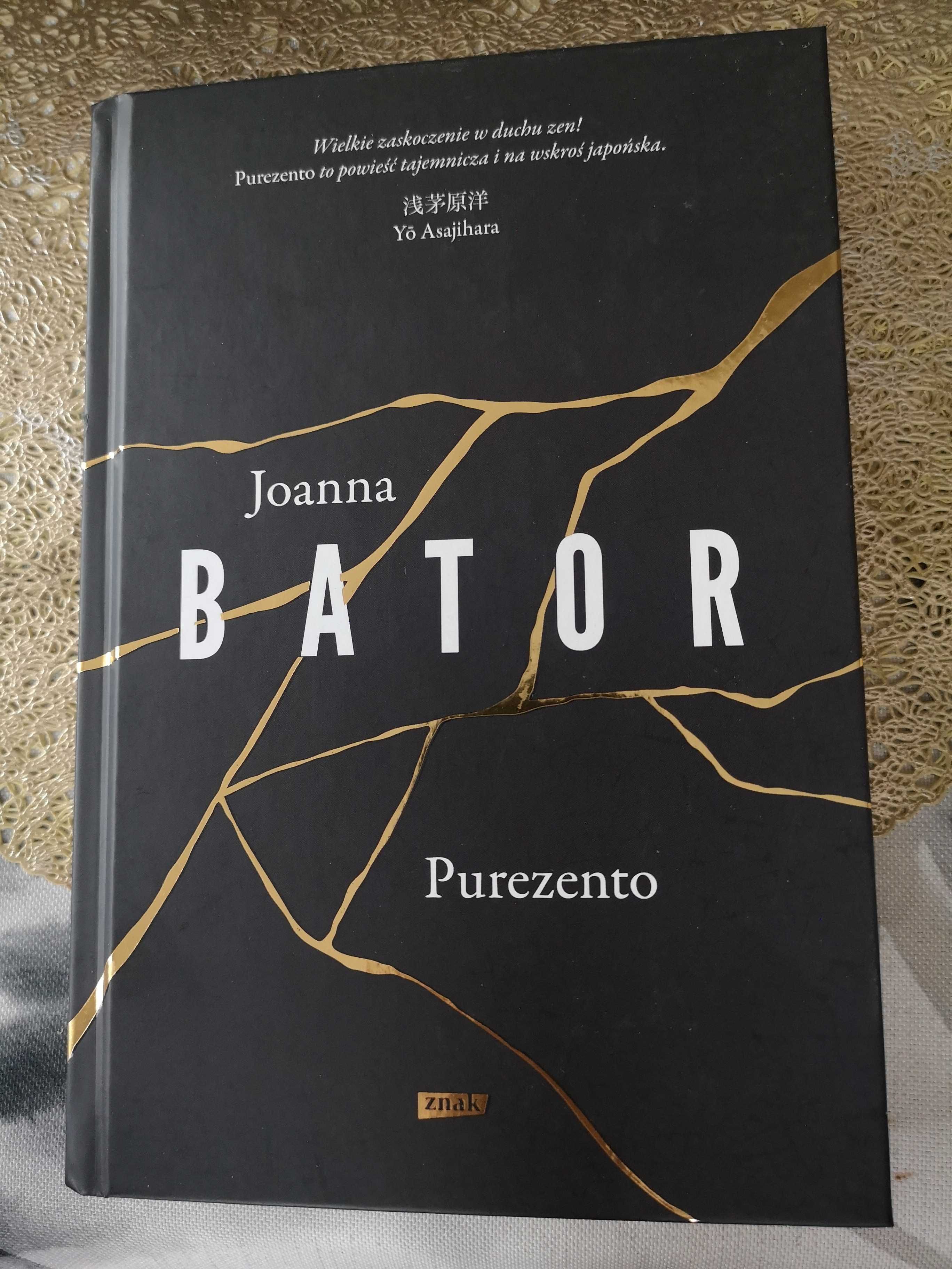 Książka: Purezento. Joanna Bator. Lekkie odbarwienie od kleju