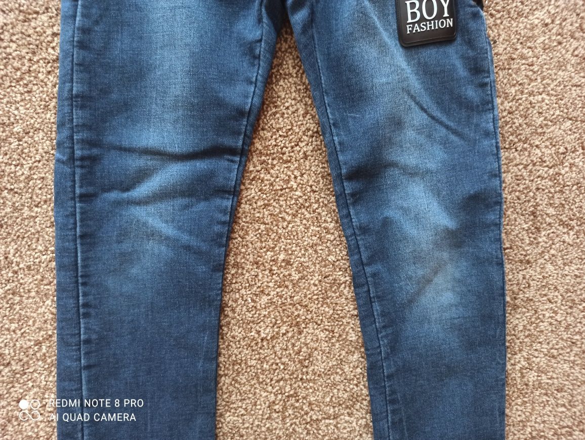 Spodnie jeansowe r. 134/140