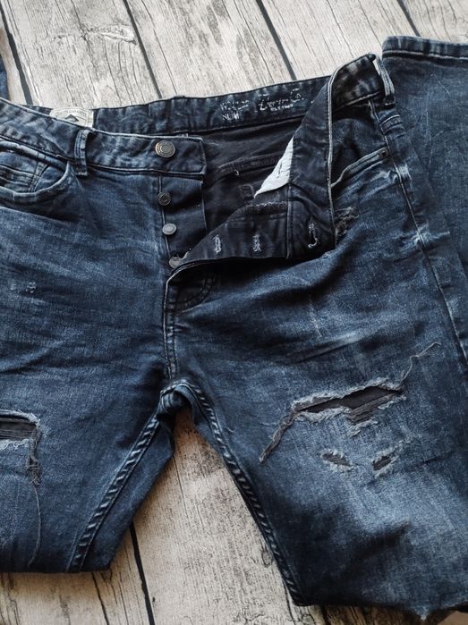 Authentic supply jeansy męskie z dziurami
