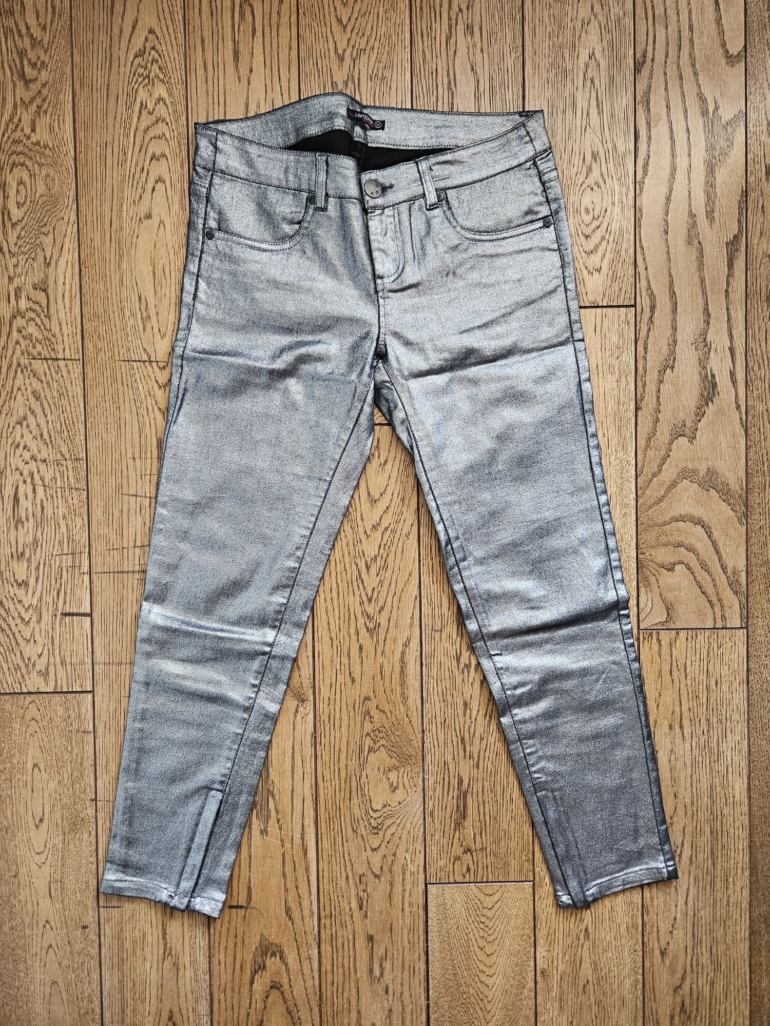 Nieużywane eleganckie spodnie damskie, rurki,srebrne,Terranova, rozm M