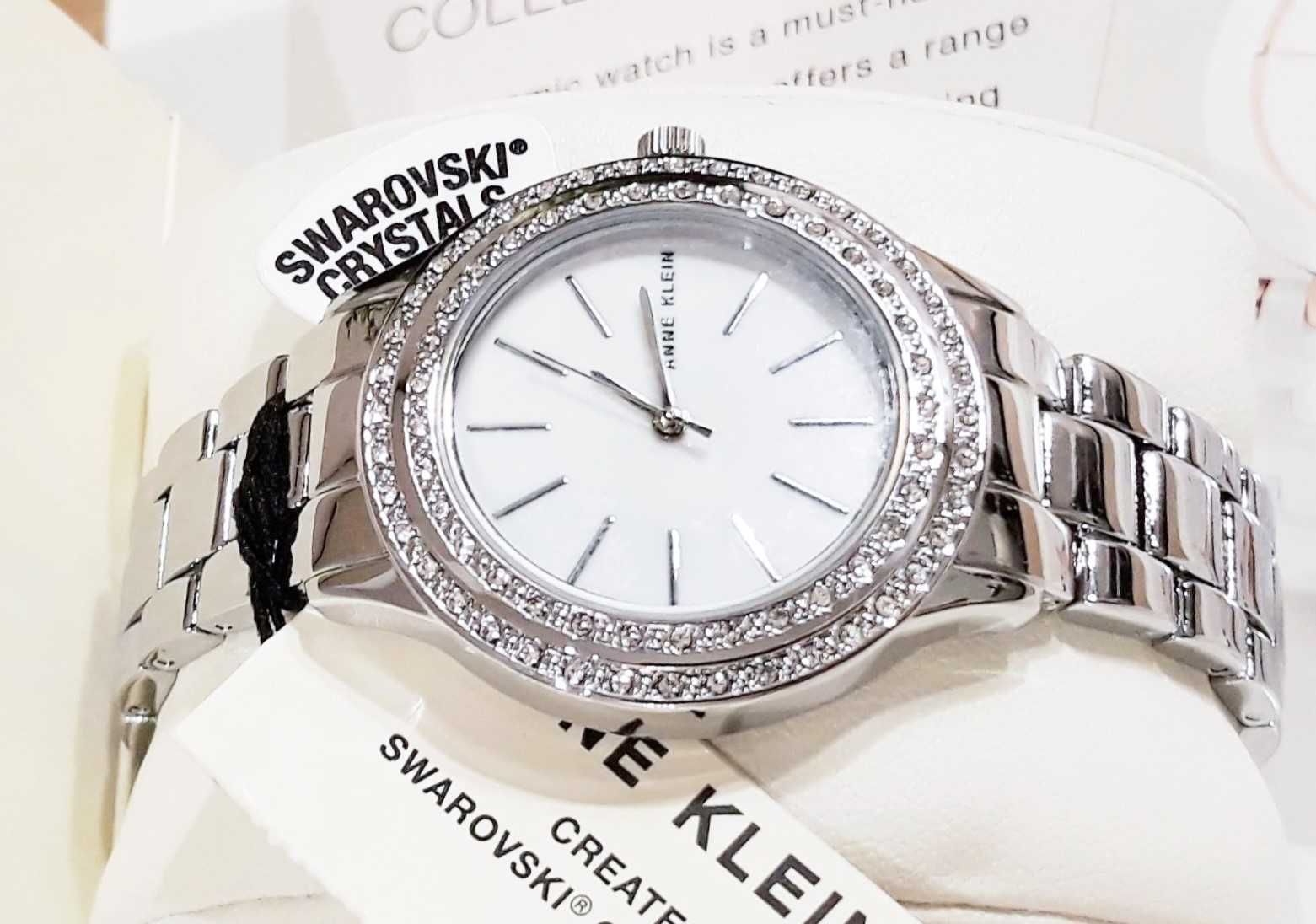 ANNE KLEIN Zegarek SWAROVSKI Krysztalki Srebrny Masa Perlowa Calvin