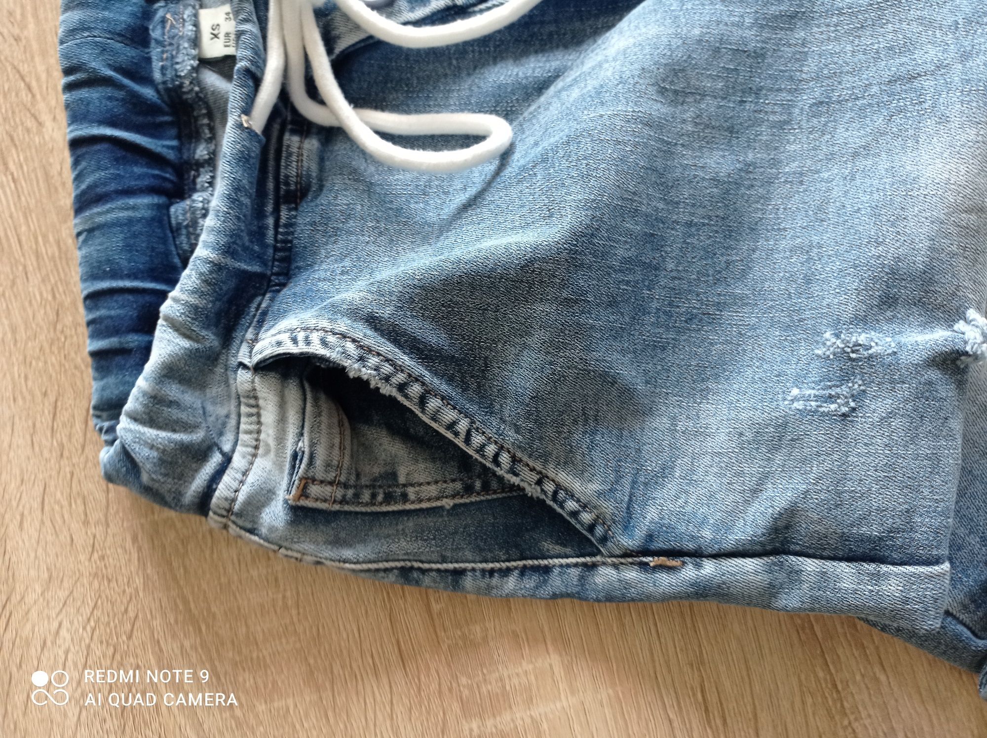 Spodnie jeans 34