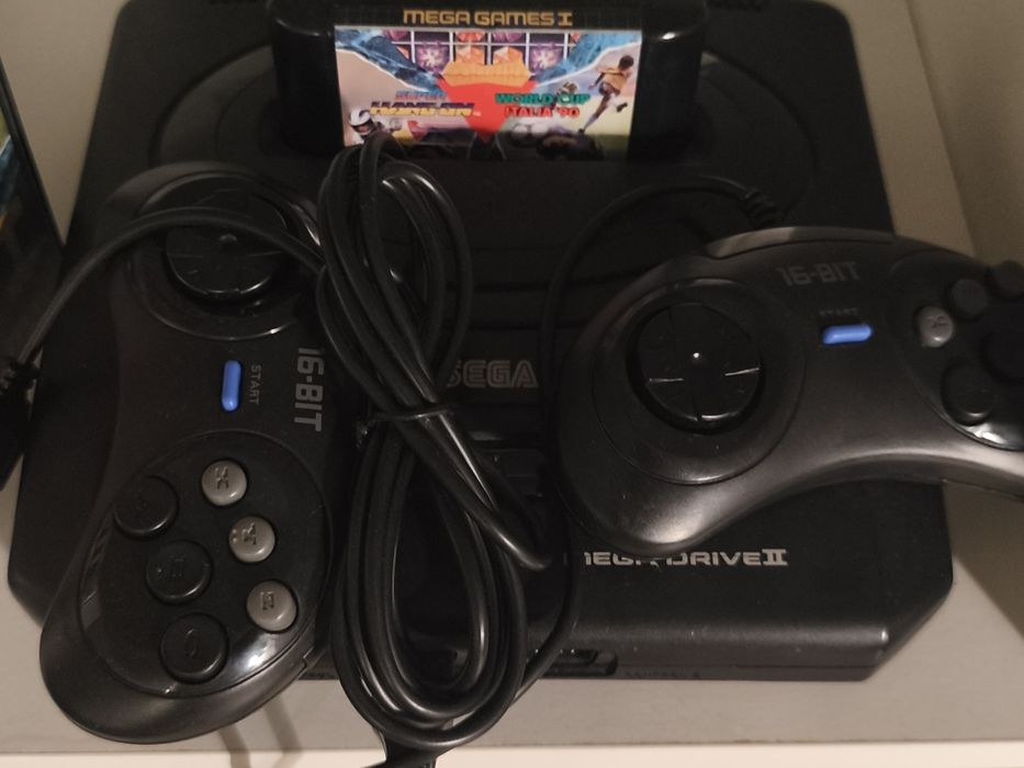 Mega drive, 2 comandos e 1  jogo