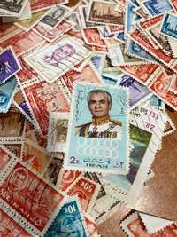 Vários lotes de 100 selos antigos do Irão