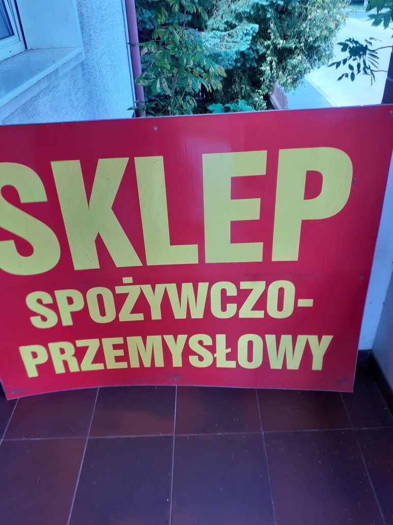 Szyld reklamowy na nierdzewnej bl.