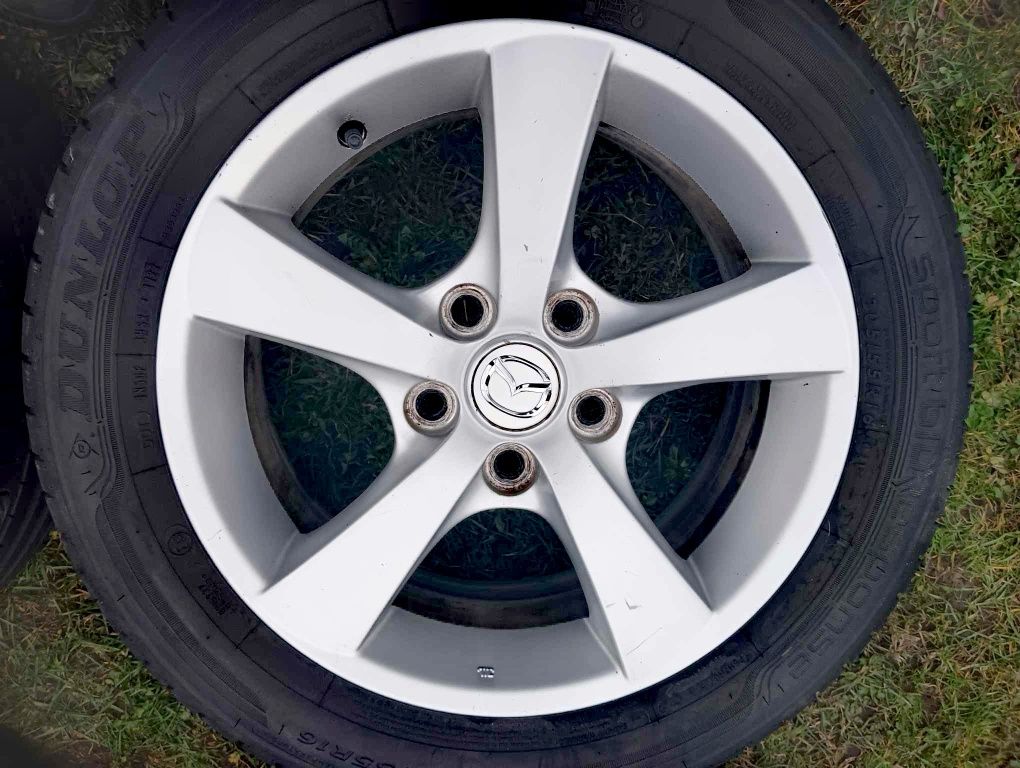 Oryginalne felgi aluminiowe mazda 16" z oponami DUNLOP